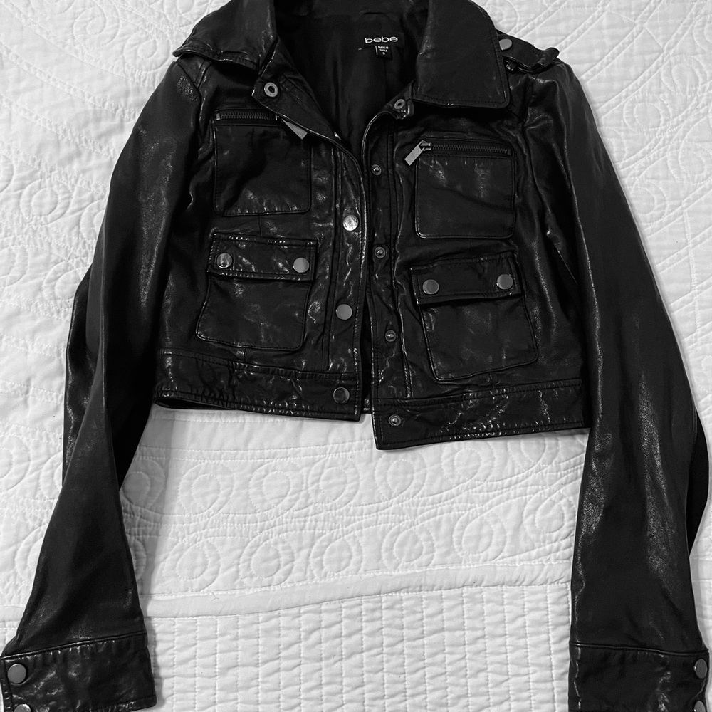 BEBE black Cropped leather jacket black. Bottom up jacket with zippered pockets